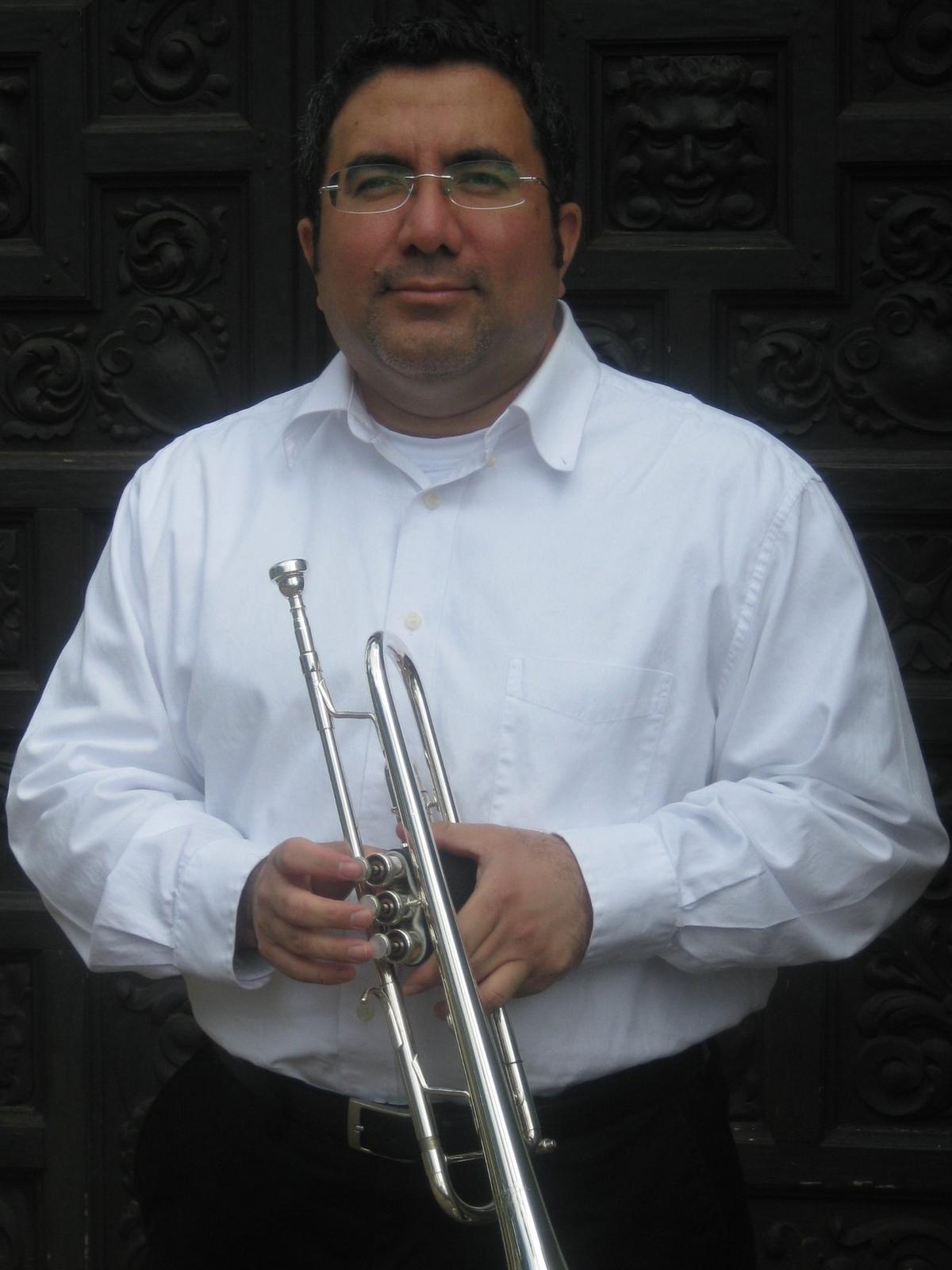 Picture of a younger Mr. D with trumpet